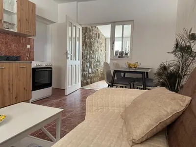 a living room with a couch and a table at Apartment Laganini-Bar in Bar, Susanj