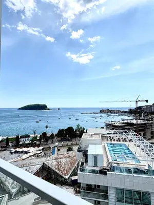 a view of the ocean from the balcony of a building at Luxury penthouse in Tre Canne complex in Budva