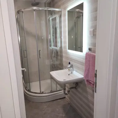 a bathroom with a shower and a sink at Stan Na Dan Podgorica Zabjelo1 in Podgorica