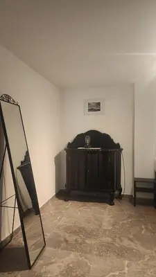 a room with a bed in the corner of a room at Villa Kotor Air in Muo
