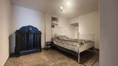 a bedroom with a bed in a room at Villa Kotor Air in Muo