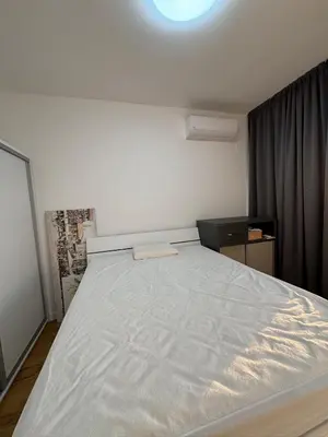 a bedroom with a large white bed in it at Soho City A in Bar