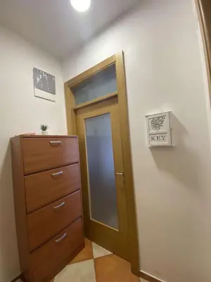 a room with a dresser and a mirror and a door at Pico apartments in Ulcinj