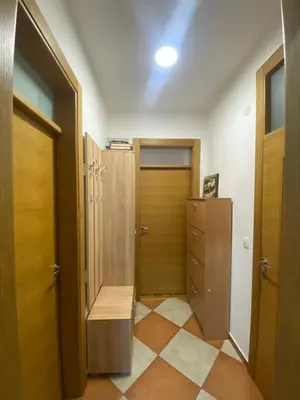 a room with a hallway with a door and a closet at Pico apartments in Ulcinj