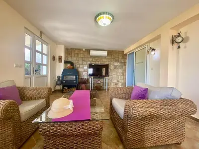 a living room with a couch and a table at Villa Maja in Sutomore