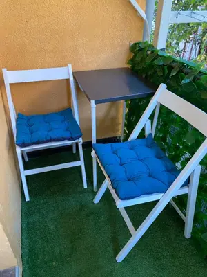 two chairs sitting next to a table and a table at Lucky Space 2 Nice&Cozy Studio in Budva