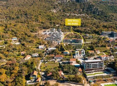 a city with a sign that reads you will be here at Casa Montenegro Lux Apartment 1 Bedroom 1 livingroom Sea & Pool View in Tivat