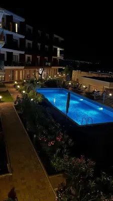 a swimming pool at night in a building at Casa Montenegro Lux Apartment 1 Bedroom 1 livingroom Sea & Pool View in Tivat
