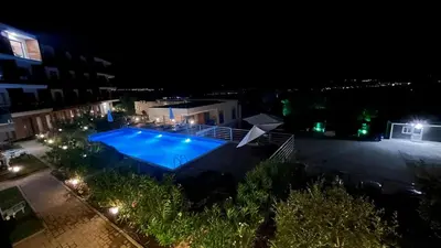 an overhead view of a swimming pool at night at Casa Montenegro Lux Apartment 1 Bedroom 1 livingroom Sea & Pool View in Tivat