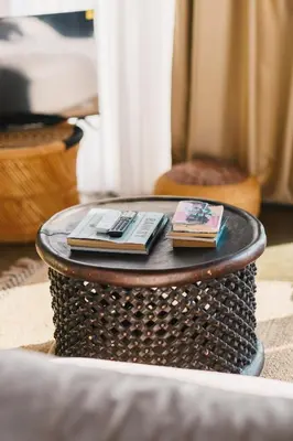 a coffee table with two books on top of it at Cottage REE in Ulcinj