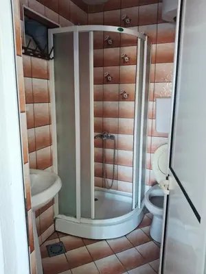 a bathroom with a shower and a toilet at Apartman Oaza 1 in Ulcinj