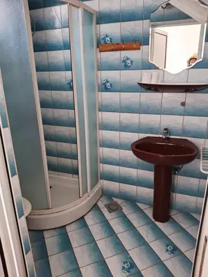 a bathroom with a sink and a shower at Apartman OAZA 3 in Ulcinj