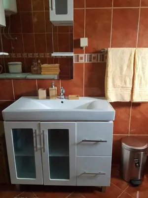 a bathroom with a white sink and a mirror at Apartments Sofia in Bar