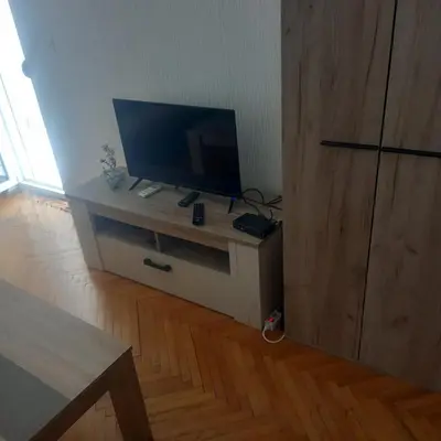 a flat screen tv sitting on top of a cabinet at Apartman Stella in Budva
