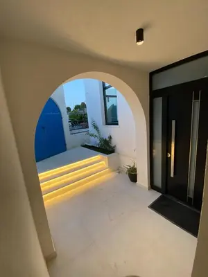 a hallway with an archway and stairs in a house at Carpe Diem 1 in Ulcinj