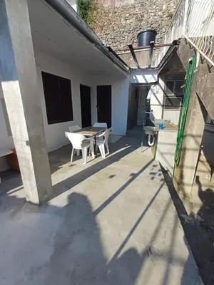 a shadow of a person standing on a patio at Apartmani Reef House in Sutomore