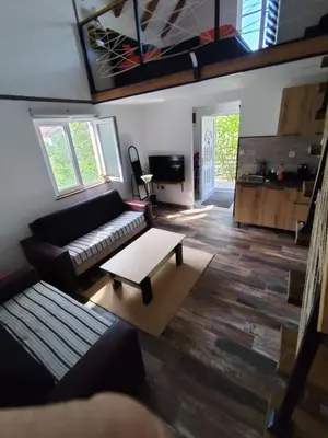 a living room with a couch and a coffee table at Cottage in nature of Cetinje in Cetinje