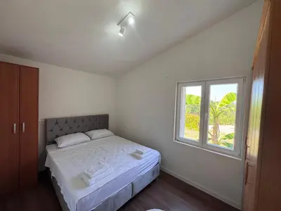 a bedroom with a bed and a window at Rajkovic Stay Bukovik in Bukovik