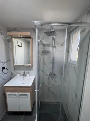 a bathroom with a shower and a sink at Rajkovic Stay Bukovik in Bukovik