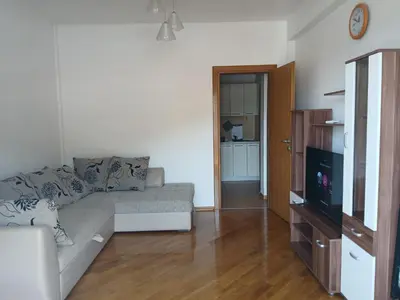 a living room with a couch and a flat screen tv at Apartment EVA in Budva - 55 m2 in Budva