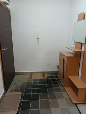 a room with a white wall and a cabinet and a floor at Apartment EVA in Budva - 55 m2 in Budva