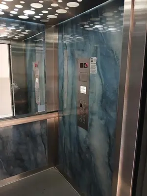 an elevator in a subway train with a glass door at Apartment EVA in Budva - 55 m2 in Budva
