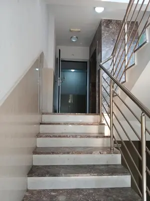 a set of stairs in a building with a door at Apartment EVA in Budva - 55 m2 in Budva