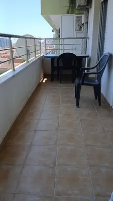 a balcony with a table and chairs on a balcony at Apartment EVA in Budva - 55 m2 in Budva
