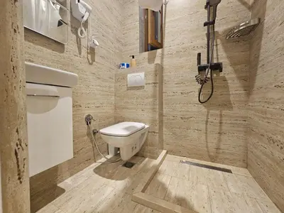 a bathroom with a toilet and a shower at patrik in Kotor