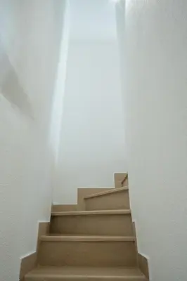 a set of stairs in a white room at Casa Campana in Kotor