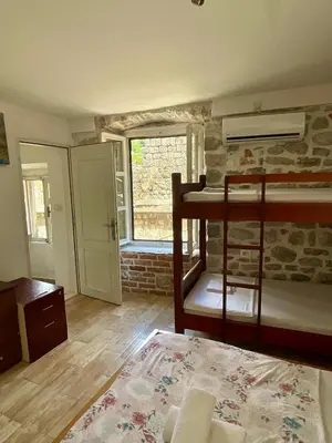 a bedroom with a bunk bed in a room at sar 2 in Kotor