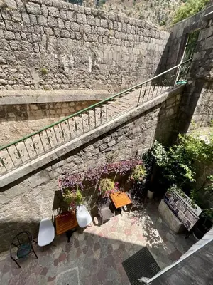 an overhead view of a patio with benches and flowers at sar 2 in Kotor