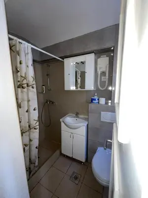 a bathroom with a sink and a toilet and a mirror at sar 3 in Kotor