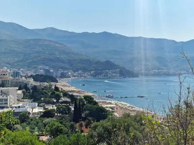 a view of a city and a body of water at Skyline lux apartman Becici sa pogledom na more in Budva