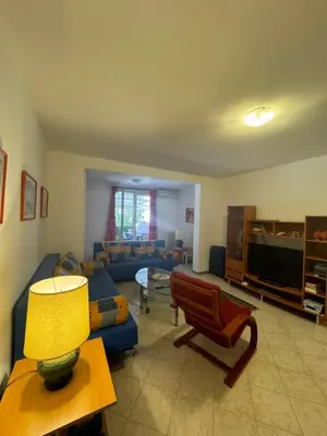 a living room with a couch and a table at Apartman Luka5 in Petrovac na Moru