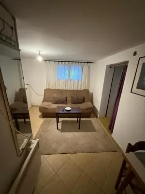 a living room with a couch and a table at Apartman centar in Podgorica