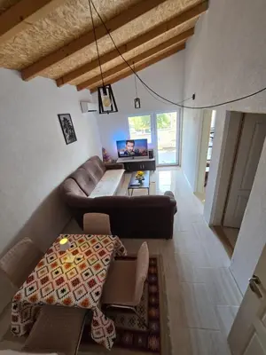 a living room with a couch and a table at Apartment on Long Beach Velika plaza near Ada Bojana in Ulcinj