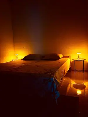 a bedroom with a bed with two lamps on it at Apartment on Long Beach Velika plaza near Ada Bojana in Ulcinj
