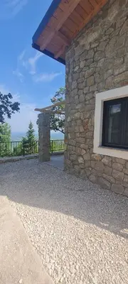 a stone building with a window on the side of it at Sunrise Nest - Tinyhouse in Bar