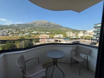a balcony with a table and chairs and a view at Apartment Buena vista in Dobra Voda