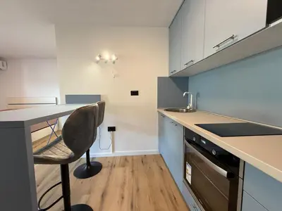 a kitchen with a desk and a chair in it at Apartment Buena vista in Dobra Voda