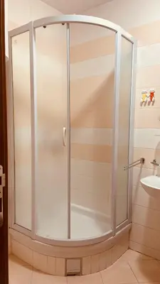 a shower with a glass door in a bathroom at One bedroom apartment Podgorica in Podgorica