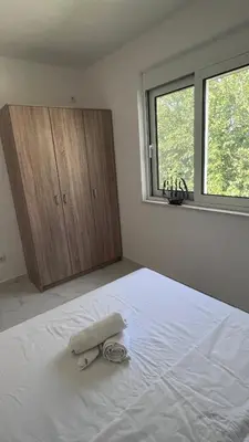 a bedroom with a bed with a towel on it at Villa Giovanna in Donji Štoj