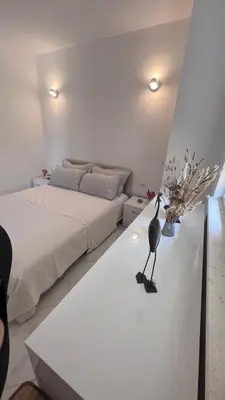 a bedroom with a bed and a table with a bird on it at Villa Giovanna in Donji Štoj