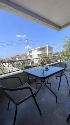 a patio with a table and chairs on a balcony at Villa Giovanna in Donji Štoj