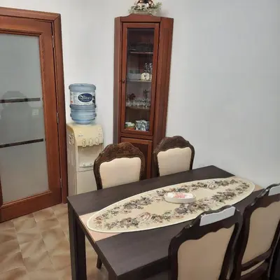 a dining room with a table and chairs at Apartman HOME Kotor in Kotor