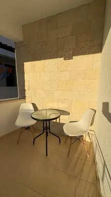two chairs and a table and a table and chairs at Zaytoon Residence in Ulcinj