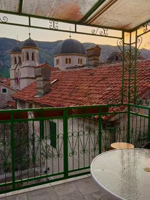 a balcony with a table and a view of a building at Balcony with Old Town view in Kotor