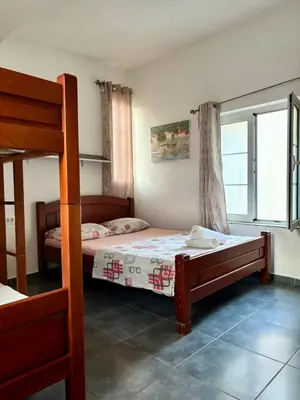 a bedroom with two bunk beds and a window at Balcony with Old Town view in Kotor
