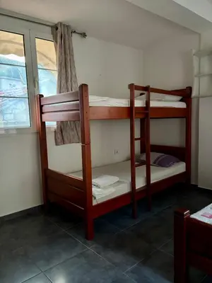 two bunk beds in a room with a window at Balcony with Old Town view in Kotor